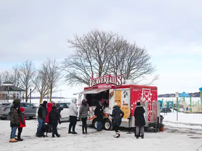 lineup of people in parking lot at Beavertails food truck